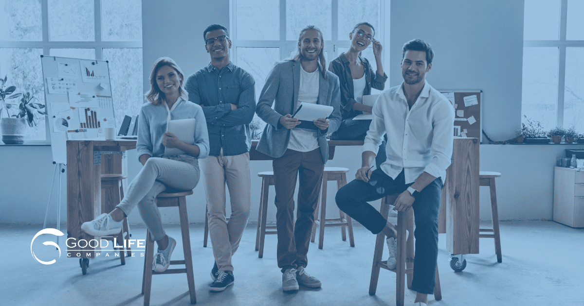 a group of young financial advisors smiles